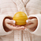 oasis pure beeswax round candle in hands