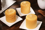 three pure beeswax pillars in the sun