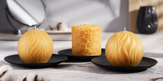A set of three pure beeswax candles