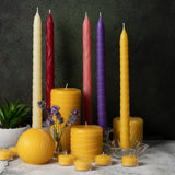 Candle arrangement with beeswax tapers. pillars, round and tealights