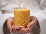 passion pure beeswax candle in hands