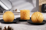 three pure beeswax candles